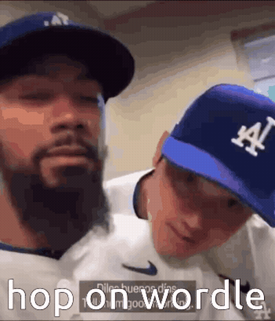 Two Men Wearing La Hats GIF