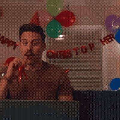 Two Men Wearing Party Hats Are Smiling In Front Of A Sign That Says " Happy " GIF