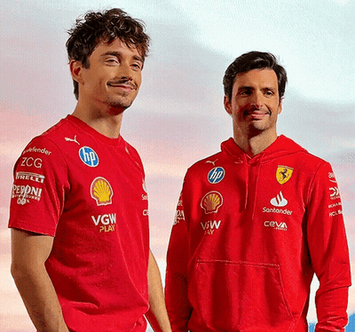 Two Men Wearing Red VGW Shirts GIF