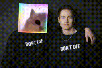 Two Men Wearing Shirts That Say Don't Die Posing GIF