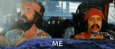 Two Men With Beards And Mustaches Are Sitting In A Car And One Of Them Is Holding A Drum . GIF