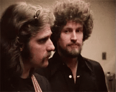 Two Men With Curly Hair And Beards GIF