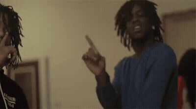 Two Men With Dreadlocks Are Standing Next To Each Other In A Room And Pointing At The Camera . GIF