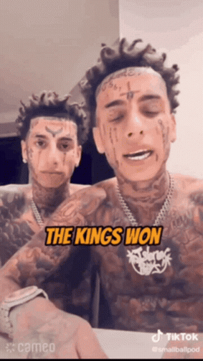 Two Men With Face Tattoos Saying The Kings Won GIF