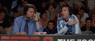 Two Men With Headphones Talking In Stadium GIF