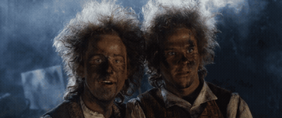 Two Men With Mud-Covered Faces GIF