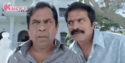 Two Men With Mustaches Making Funny Faces GIF