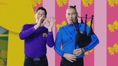Two Men With Purple Shirt Saying Wiggle GIF