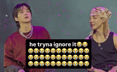 Two Men With Sign Saying He Tryna Ignore It GIF
