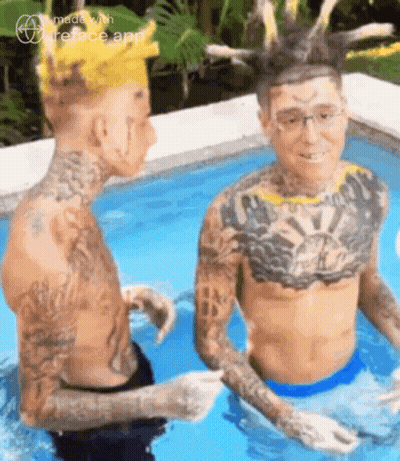 Two Men With Tattoos Sitting In Pool GIF