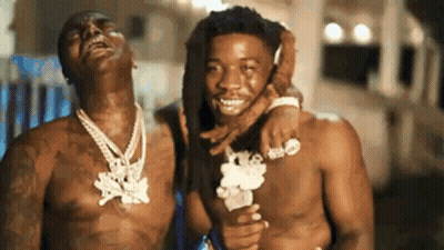 Two Men Without Shirts Are Standing Next To Each Other And Smiling . GIF