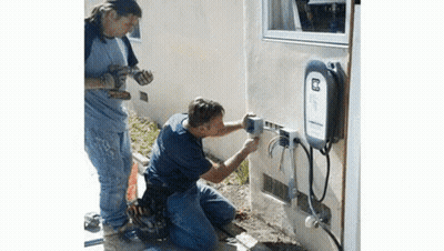 Two Men Working On Electrical Box GIF