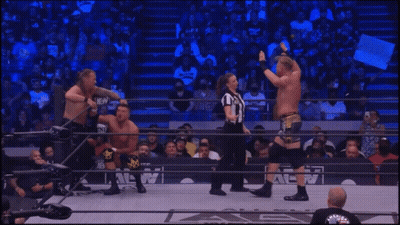 Two Men Wrestling In A Ring GIF