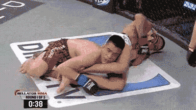 Two Men Wrestling In Boxing Ring GIF