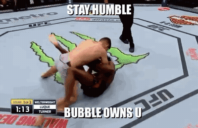 Two Men Wrestling In Boxing Ring Stay Humble Bubble Owns U GIF