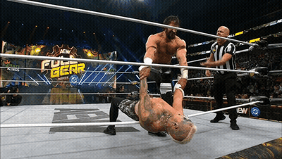 Two Men Wrestling In Full Gear Ring GIF