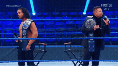 Two Men Wrestling In Ring GIF