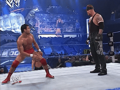 Two Men Wrestling In Ring GIF