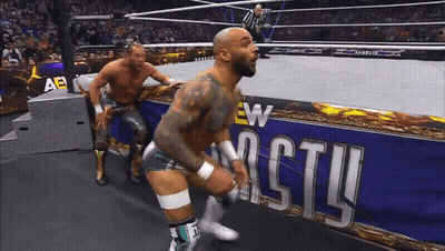 Two Men Wrestling In Ring, New Castle Banner GIF