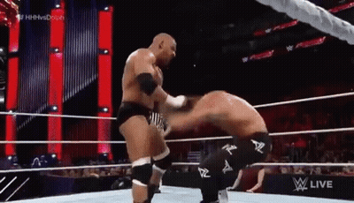 Two Men Wrestling In Ring One Kneeling GIF