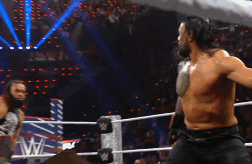 Two Men Wrestling In Ring GIF