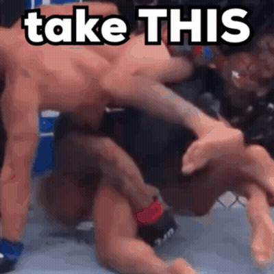 Two Men Wrestling In Ring Saying Take This GIF