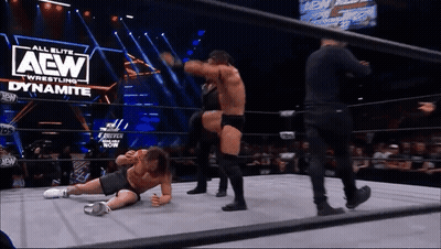 Two Men Wrestling In Ring With AEW Logo GIF