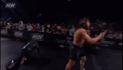 Two Men Wrestling In Ring With Crowd GIF