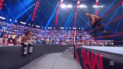 Two Men Wrestling In Ring With Crowd GIF