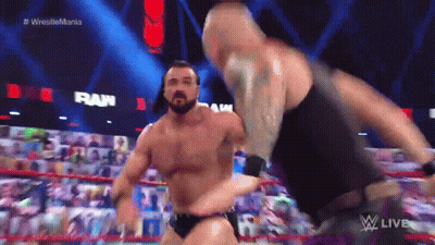 Two Men Wrestling In Ring With Crowd GIF
