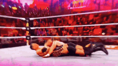 Two Men Wrestling In Ring With Crowd GIF