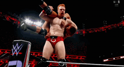 Two Men Wrestling In Ring With Crowd GIF