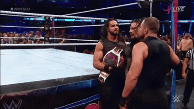 Two Men Wrestling In Ring With Crowd GIF