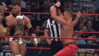 Two Men Wrestling In Ring With Dynamite GIF