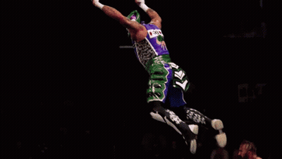 Two Men Wrestling In Ring With Dynamite Banner GIF