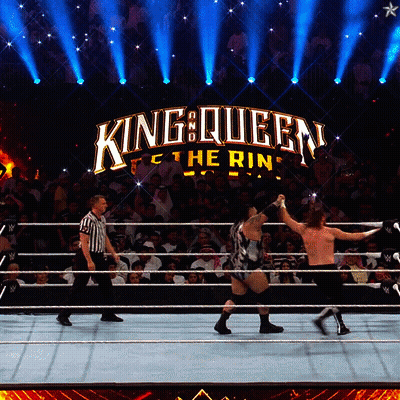 Two Men Wrestling In Ring With King Queen Logo GIF