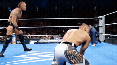 Two Men Wrestling In Ring With Mr. Do Me Patch GIF