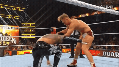 Two Men Wrestling In Ring With RAW Sign GIF