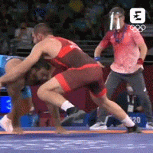 Two Men Wrestling In Ring With Referee GIF