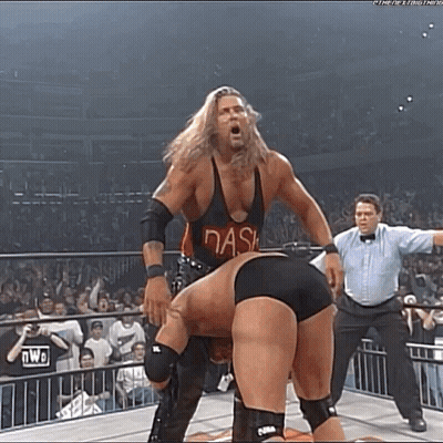 Two Men Wrestling In Ring With Referee GIF