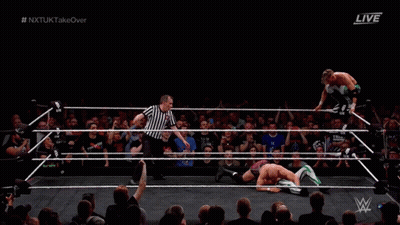 Two Men Wrestling In Ring With Referee GIF