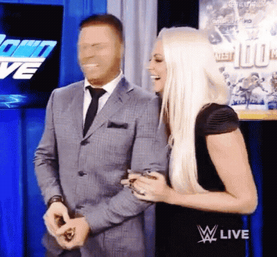 Two Men Wrestling In Ring With Rina General Shorts GIF