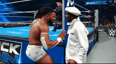 Two Men Wrestling In Ring With Smack Down Sign GIF
