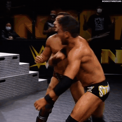 Two Men Wrestling In Ring With Sting Shorts GIF