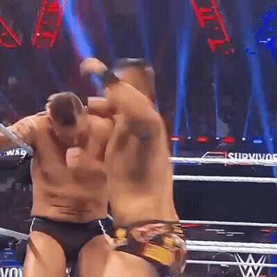 Two Men Wrestling In Ring With Survivor GIF
