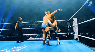 Two Men Wrestling In Ring With W Logo GIF