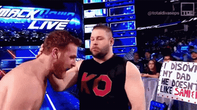 Two Men Wrestling In Stadium, One In KO Shirt GIF