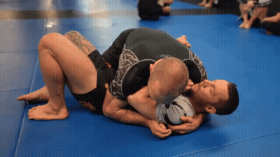Two Men Wrestling On Blue Mat GIF