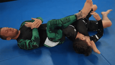 Two Men Wrestling On Mat GIF