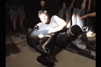 Two Men Wrestling, One In 'A' T-Shirt GIF